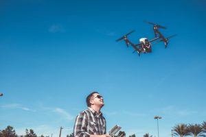 man flying a drone